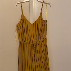 Yellow jumpsuit with black stripes